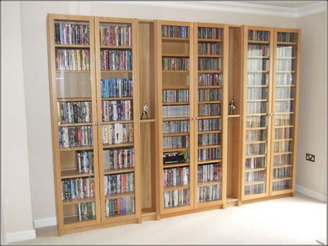 Hidden Dvd Storage Cabinet | Dvd storage cabinet, Diy dvd storage, Dvd storage shelves