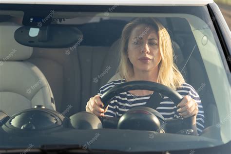 Premium Photo Anxious Scared Woman Driver Worried Looking At Car