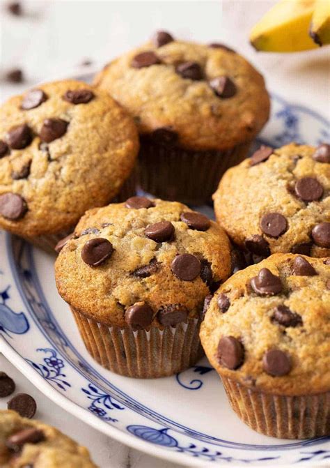 Chocolate Chip Muffins On A Blue And White Plate With Bananas In The
