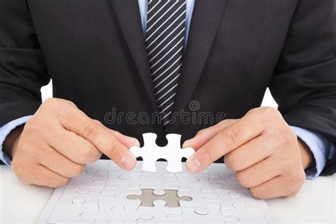 Businessman Team Work Holding Two Jigsaw Connecting Couple Puzzle Piece