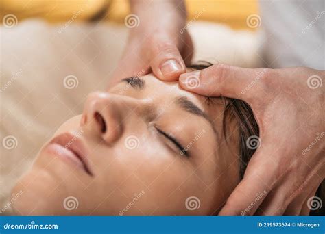 Thai Facial Rejuvenation Massage Treatment at Wellness Spa Center Stock