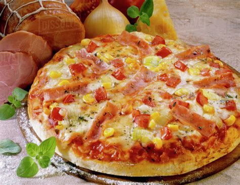 Pizza With Sweetcorn Peppers And Ham Stock Photo Dissolve