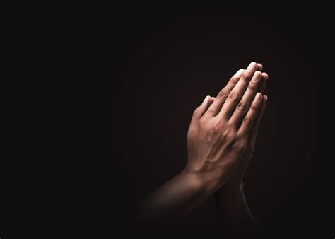 Praying Hands With Faith In Religion And Belief In God On Dark