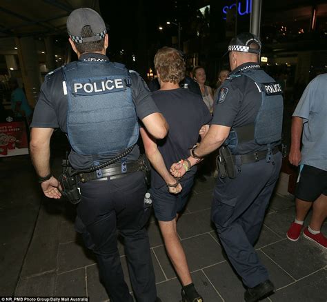 26 Teenagers In Handcuffs After Fight Erupts At Schoolies Daily Mail