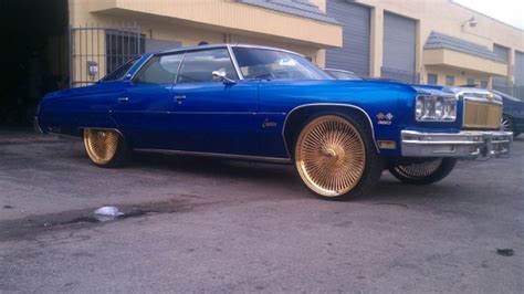 A Candy Blue Donk On 24 Inch Daytons With Paint Lookin
