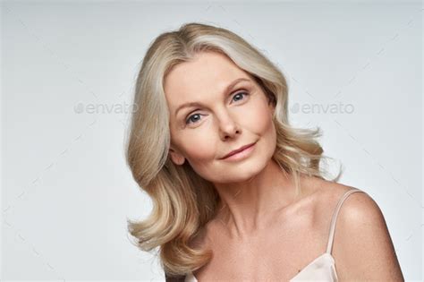 Beautiful 50s Middle Aged Mature Woman Looking At Camera Isolated On