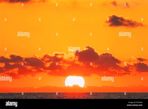 Sundown Over Sea Horizon At Sunset Natural Sunrise Sky Warm Colors