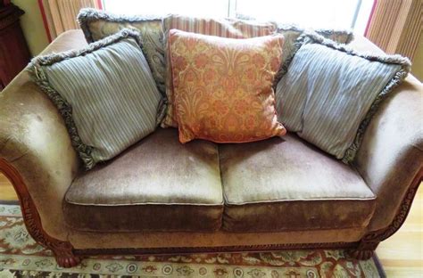 Fringe at bottom of sofa and chair as well as large throw pillows. Plush living room suite includes sofa, loveseat, rug ...