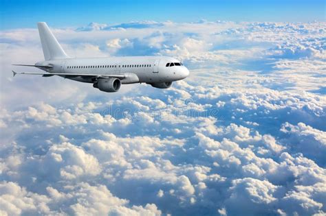 Commercial Passenger Plane Flying Above Clouds Stock Photo Image Of