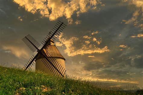 Windmill On Green Grass Field · Free Stock Photo