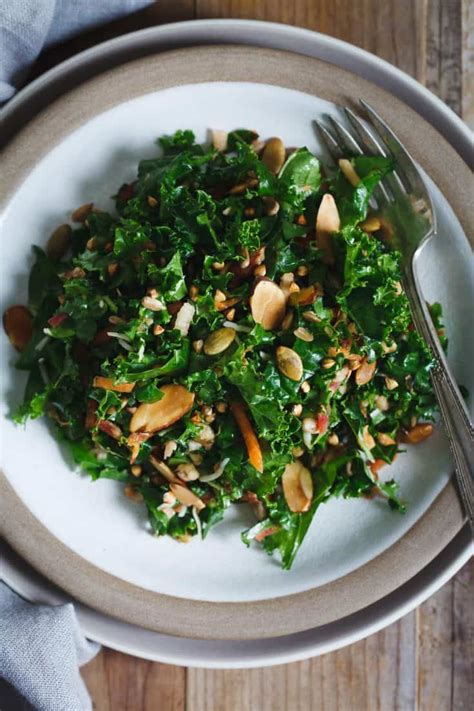 kale salad with toasted nuts seeds and buckwheat