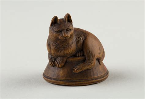 Cat netsuke japan, late 19th century the los angeles county museum of art. Netsuke of Cat Lying on a Bowl, underneath which is a Fish ...