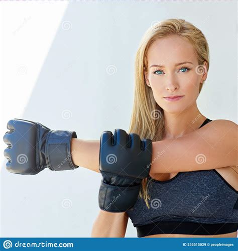 Staying Fighting Fit A Sporty Young Woman Training With Mma Gloves