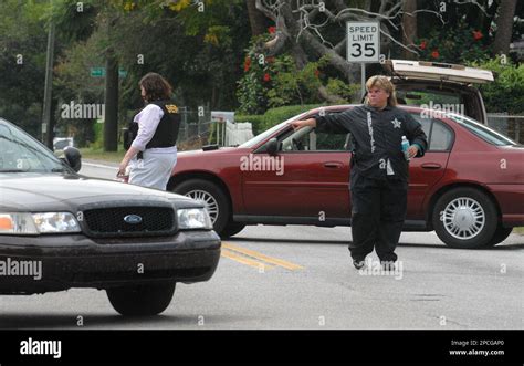Polk County Sheriff's deputies direct traffic on a street surrounding