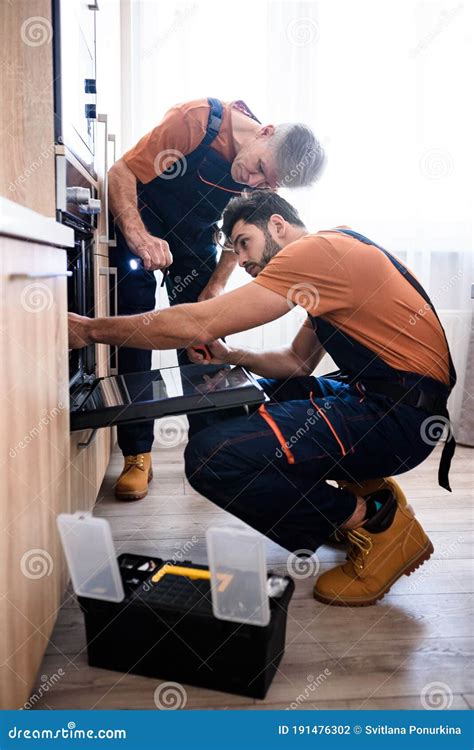 Get The Best Handyman Service Full Length Shot Of Two Repairmen
