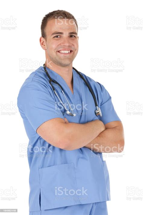 Happy Male Nurse Standing With Arms Crossed Stock Photo Download