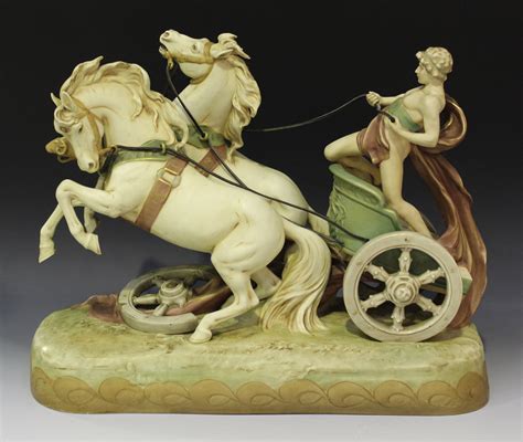 A Royal Dux Porcelain Figure Group Early Th Century Modelled As A Classical Youth Riding A Chari