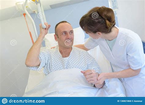 Nurse Helping Patient Lift From Bed Stock Photo Image Of Adult Care