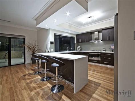 Modern japanese kitchen with the complements. Modern u-shaped kitchen design using floorboards - Kitchen ...