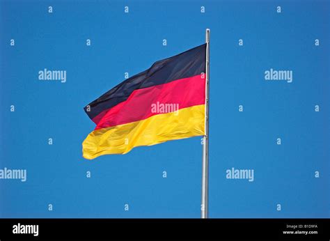 German Flag Against Blue Sky Stock Photo Alamy