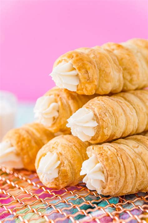 Several Croissants Are Stacked On Top Of Each Other With Icing In The