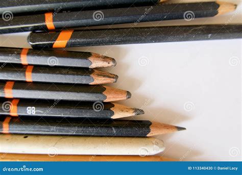 Five Very Short Soft Graphite Pencils In A Group With Other Pencils On