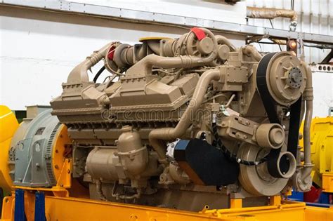Large Diesel Engine With A Huge Turbine In The Warehouse Of Finished