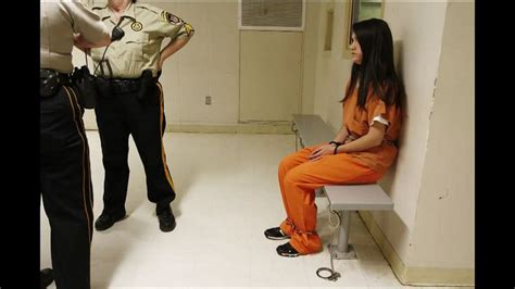 Woman In Full Shackles Chains And Handcuffs Waits To Get To The Court Press Photo