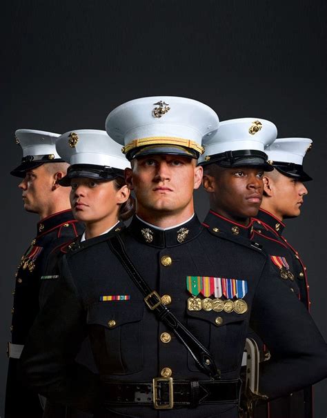 A Group Of Marines Are Shown In Dress Blues Their Medals Illuminated