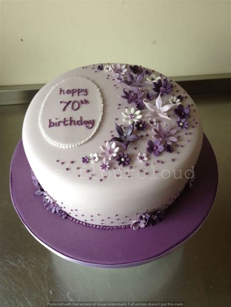 Delicate Lilac Purple And White Flowers On This 70th Birthday Cake