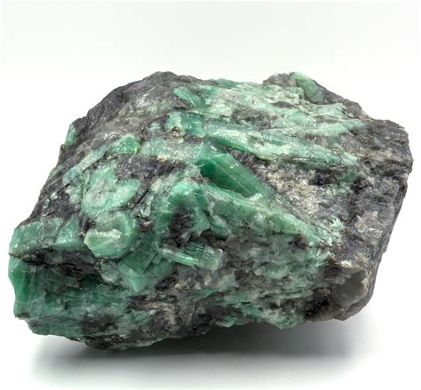 Great Raw Emerald Stone Of 2700 Grams With Matrix Of Black
