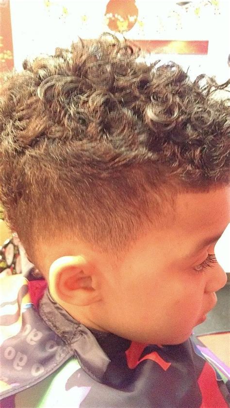 Start off with a disconnected undercut and go on to texture the top. Little Boy Curly Hairstyles | Fade Haircut