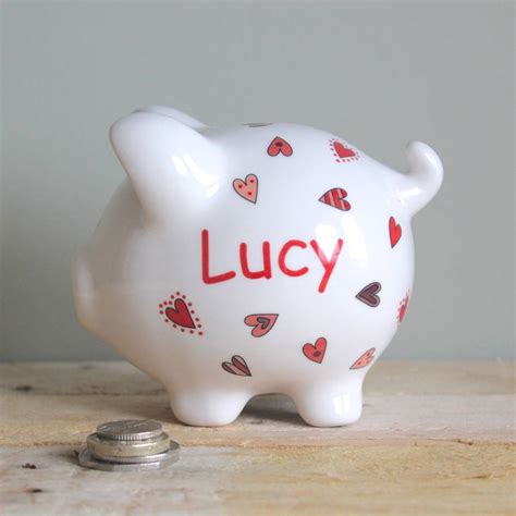 The coins slot at the top lets you use the safe as a piggy bank. Personalised Piggy Bank For Girls By Sparkle Ceramics | notonthehighstreet.com