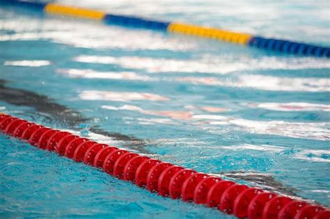 Premium Photo The View Of An Empty Public Swimming Pool Indoors Lanes