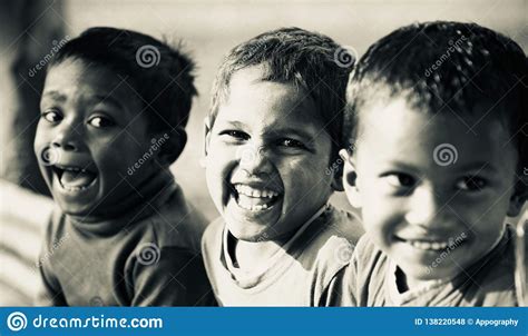 Three Poor Slum Children Playing On Sand Editorial Image