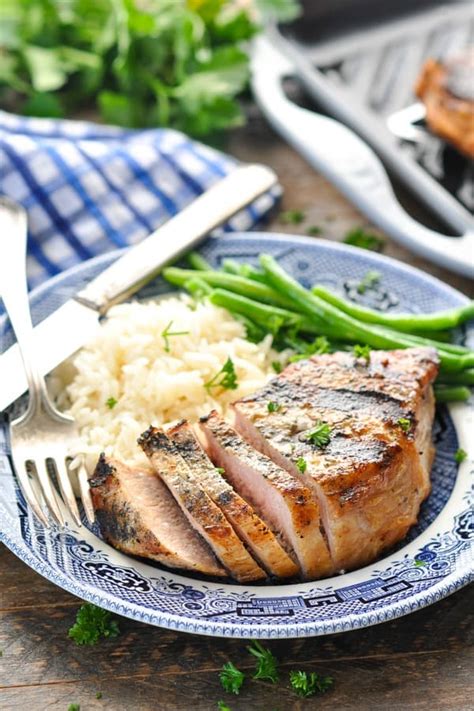 Pork chops are made tender by roasting on the grill, then searing in the juices at a high temp. Perfect 15-Minute Grilled Pork Chops - The Seasoned Mom