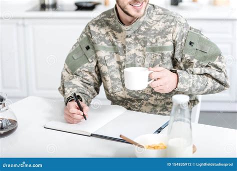 Man In Military Uniform Drink Coffee And Writing Stock Photo Image Of