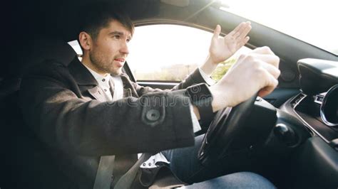 Young Business Man Driving Car Very Upset And Stressed After Hard