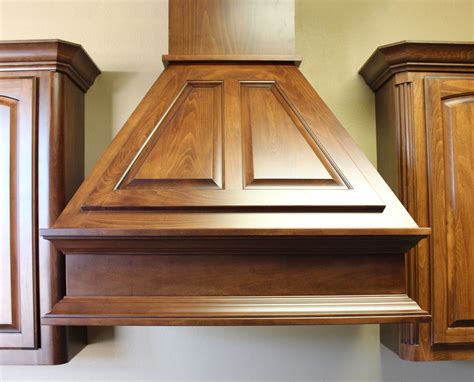 Bring the range hood out in a muted kitchen. Wood Vent Hood - HomesFeed