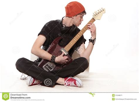 Young Man Sitting On Floor And Playing Guitar Stock Image Image Of