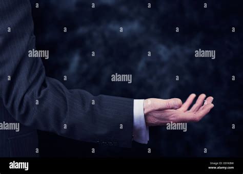 A Businessman Reaching Out To Offer Assistance Stock Photo Alamy
