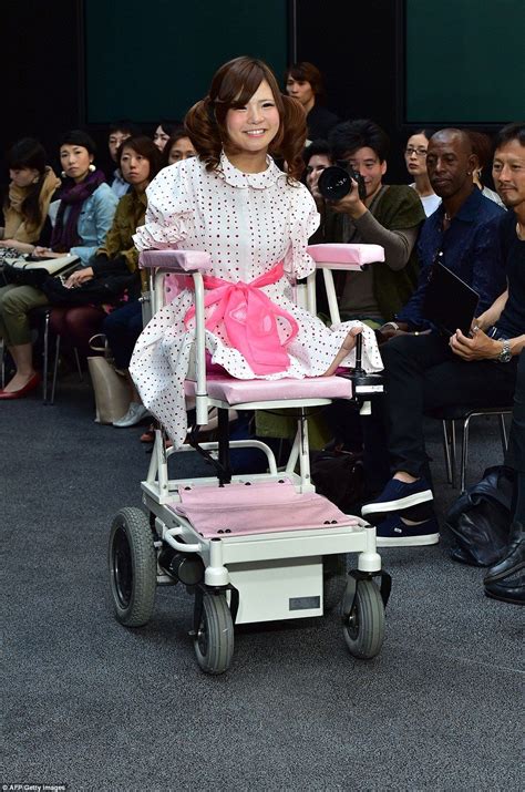disabled model ami sano sits on an electric wheelchair as she participates in japanese designer