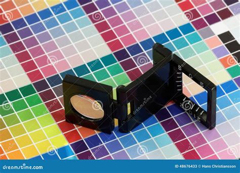 Close Up Of A Loupe On A Colorful Test Print Stock Image Image Of