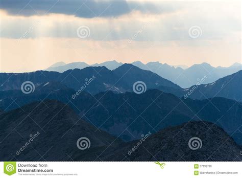 Sun Rays Shining Above Mountains In The Morning Pyrenees Stock Photo