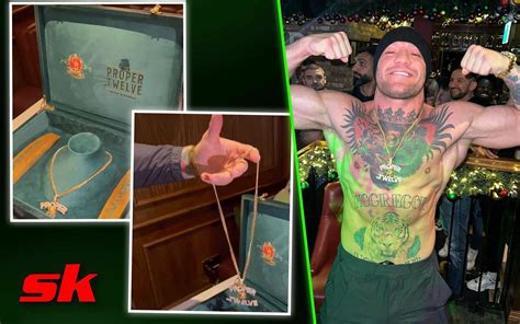 conor mcgregor poses shirtless in crumlin pub wearing custom gold chain