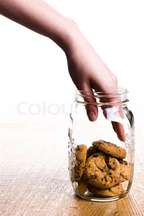 A Hand Getting A Cookie From A Jar Stock Image Colourbox