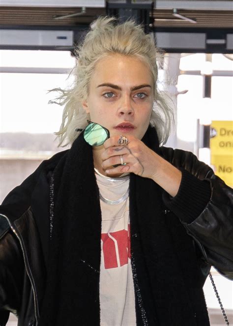 CARA DELEVINGNE at Heathrow Airport in London 03/26/2017 - HawtCelebs