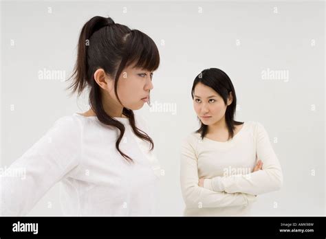 Two Young Women Glaring At Each Other Stock Photo Alamy