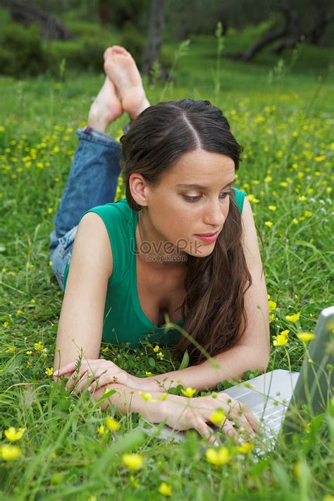 Young Woman Lying On The Grass With Laptop Picture And Hd Photos Free