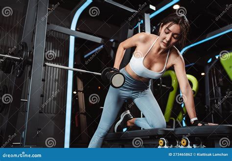 Women Working Out With Weights Training Exercise Lifting Dumbbells At